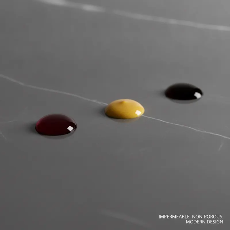 Droplets of red wine, mustard, and coffee beading up on a porcelain tile, demonstrating its stain-proof and impermeable surface.